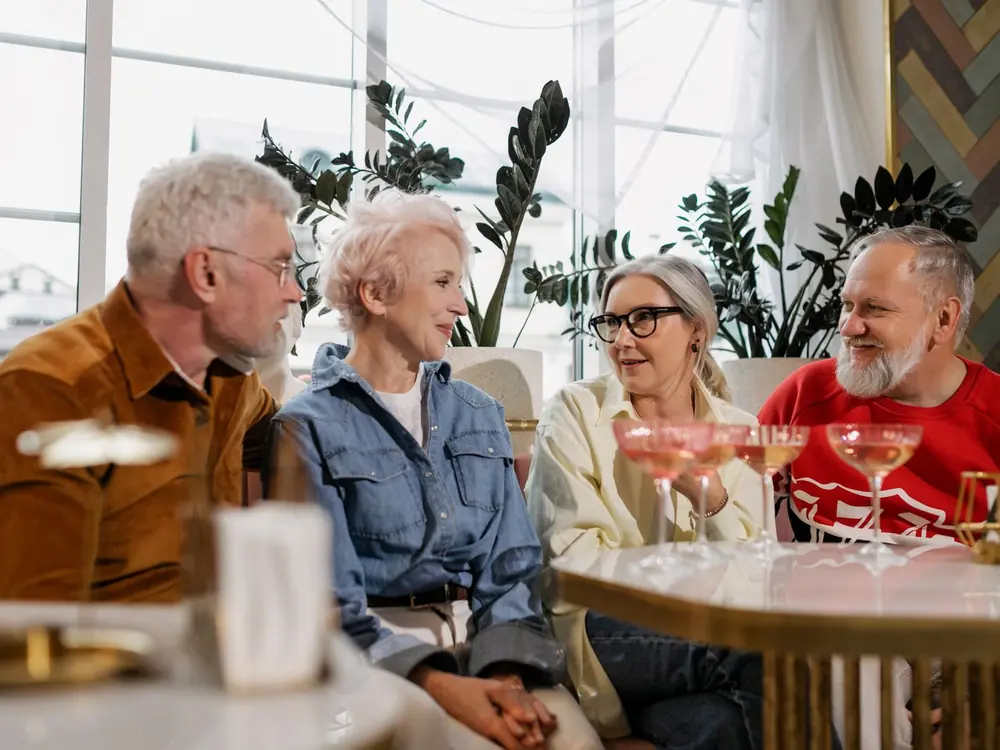 Happy senior residents enjoying a conversation together